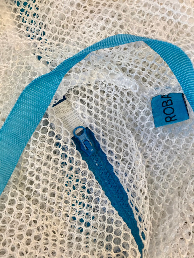 zippered mesh laundry bag with shoulder straps